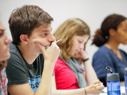 MBA students listening to lecture by Professor Godoy
