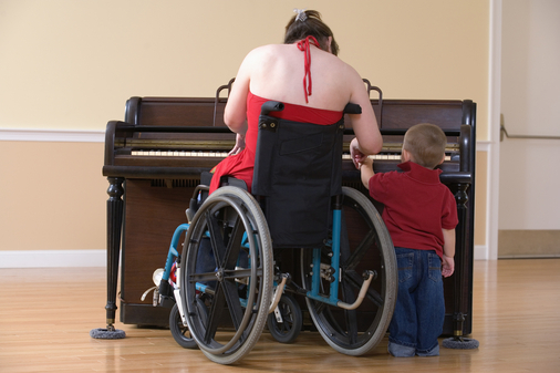 photo of mother with child in front of piano