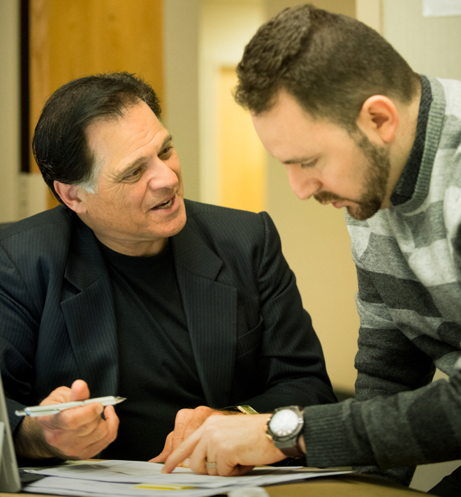 Image of EMBA for Physicians program director, Jon Chilingerian, working with a student.