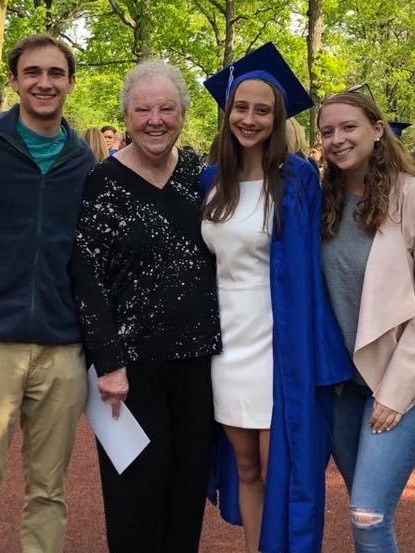 Leah Spellberg, MBA/MA Hornstein'21 at her graduation, with her grandmother and rest of her family