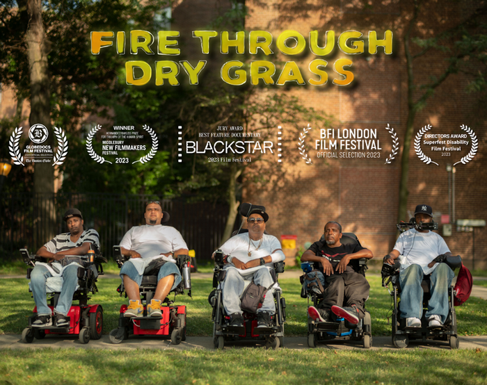 An image of 5 Black and brown men in wheelchairs looking straight into the camera. Above “Fire Through Dry Grass” is written in bold yellow block letters.