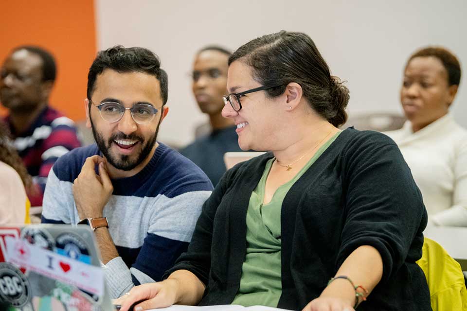 two students talking in class