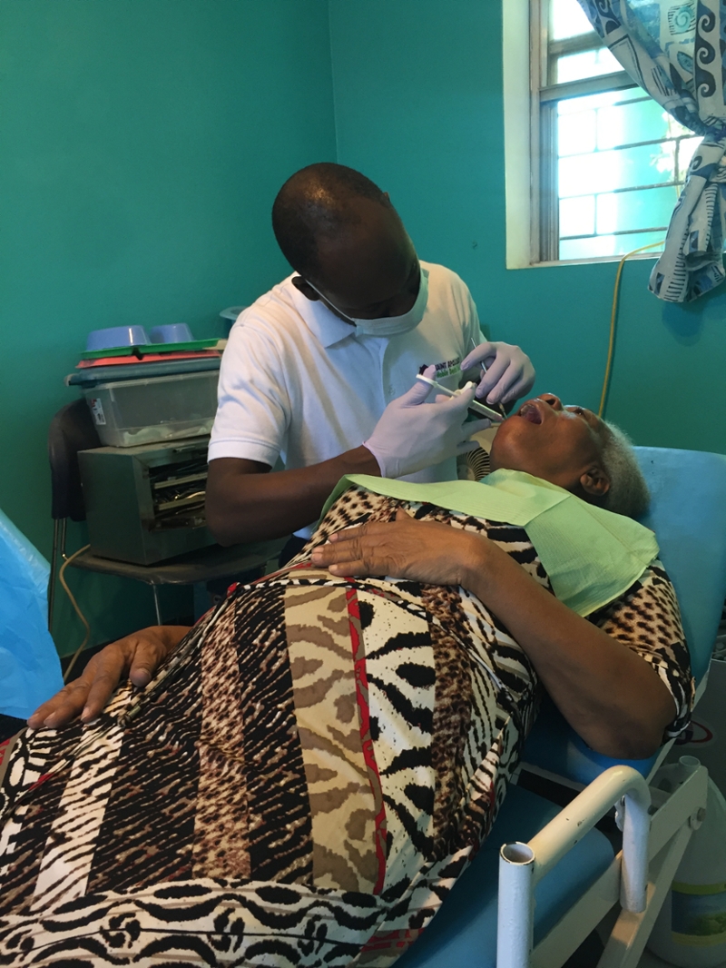 Lesly Joseph working on a patient