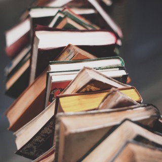 Stack of books lined up at alternating angles