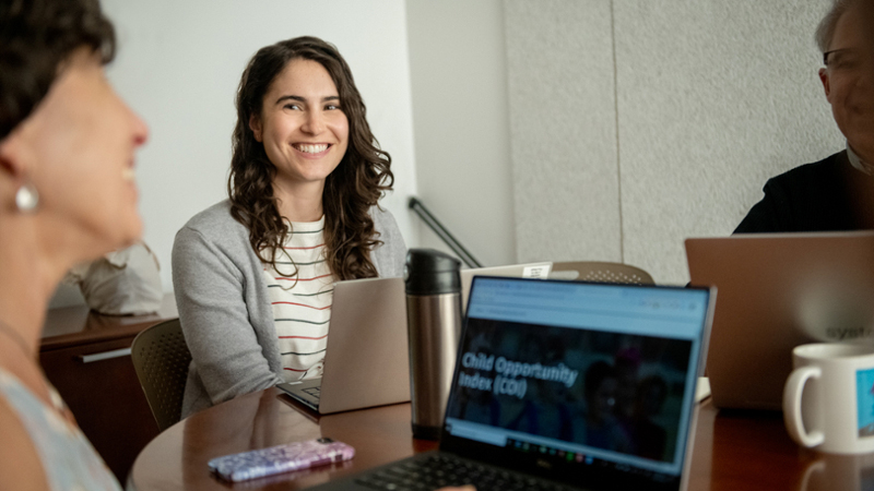 ICYFP student sitting at conference table