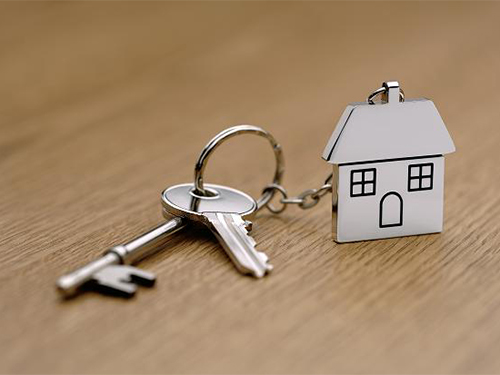 keys on a ring with a keychain the shape of a house