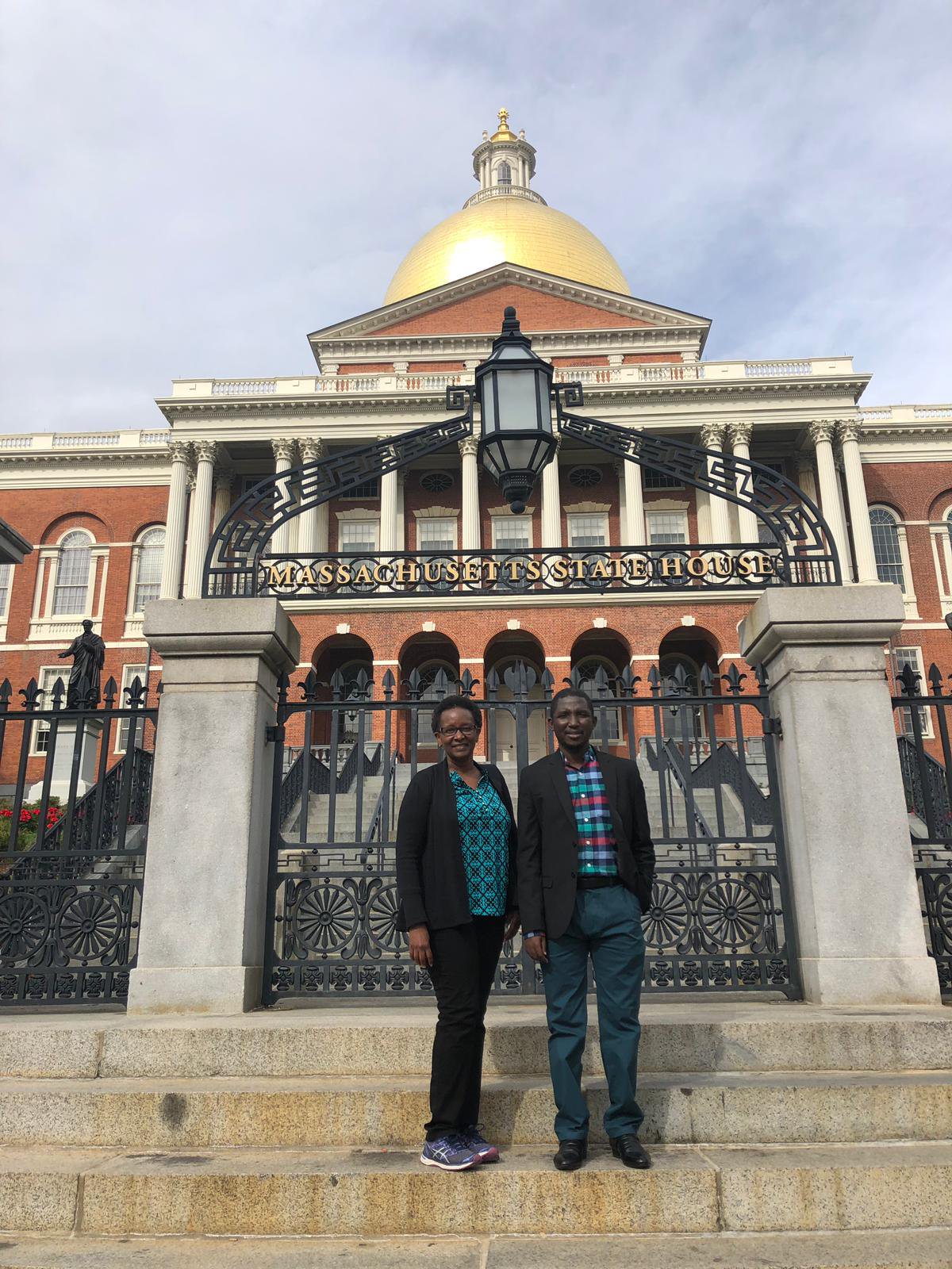 Lurie Postdoctoral Fellows Serah Nthenge and Hussain Zandam outside the Massachusetts State House
