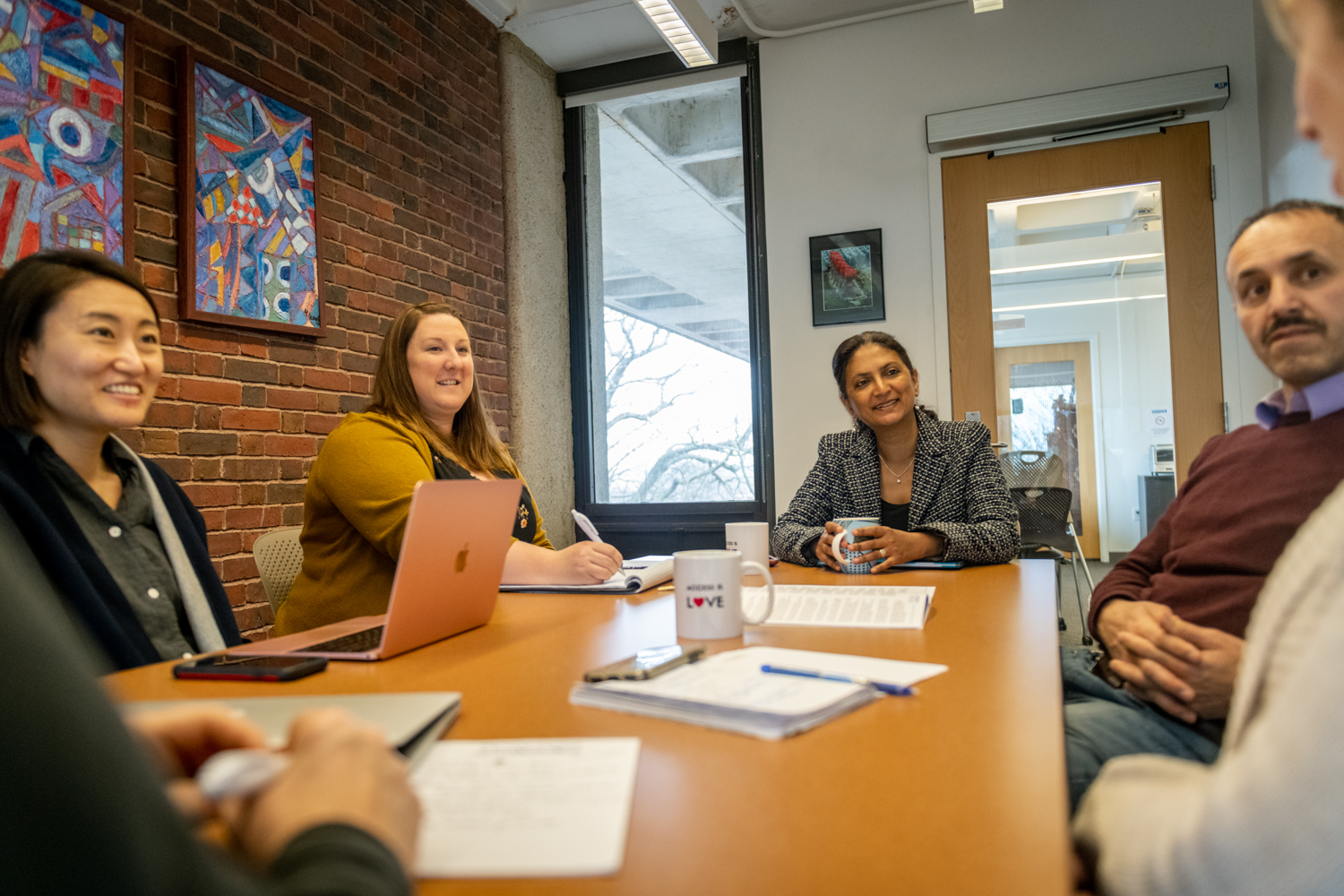 Lurie faculty and staff meeting at conference room table