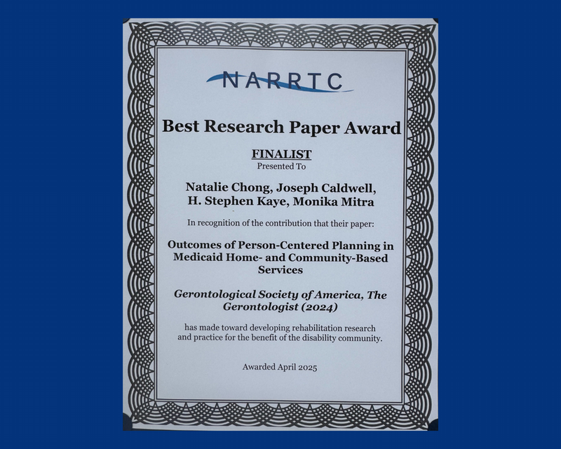 Blue award certificate for best research paper award presented to Lurie scholars.