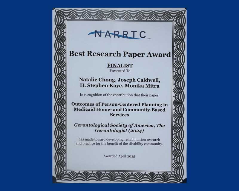 Blue award certificate for best research paper award presented to Lurie scholars.