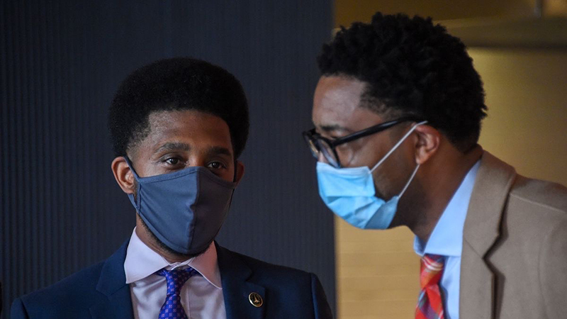 Baltimore Mayor Brandon Scott and Cal Harris, both wearing face masks
