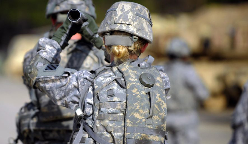 Photo of a U.S. Army women with her back to the camera.