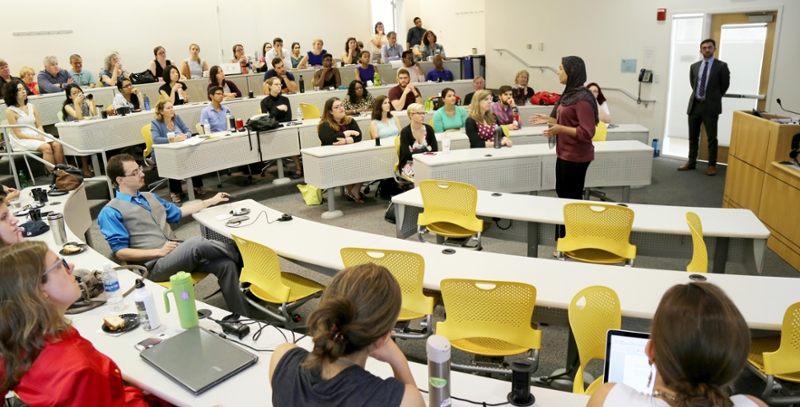 image of Mariam Hassan presenting in front of a full classroom