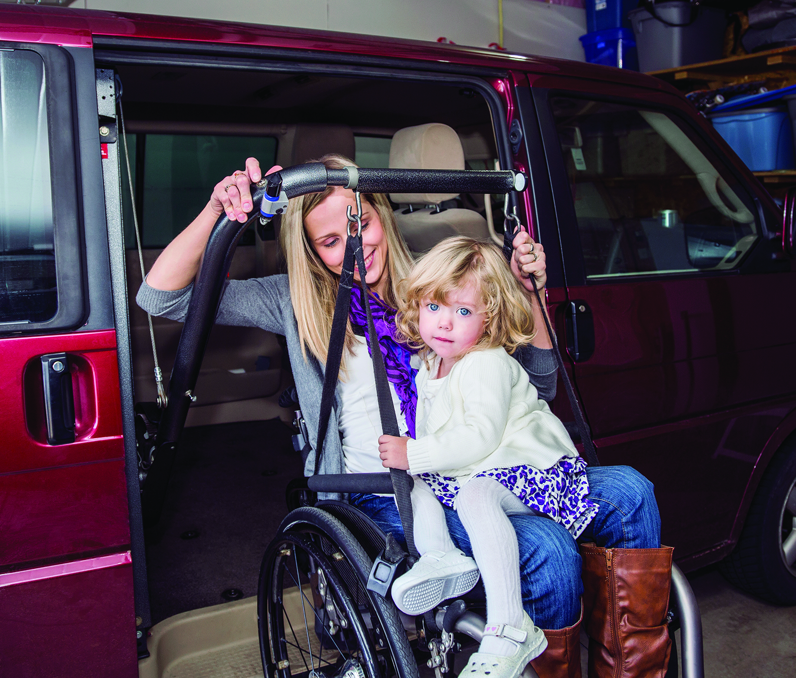 image of woman in wheelchair exiting a minivan with her toddler