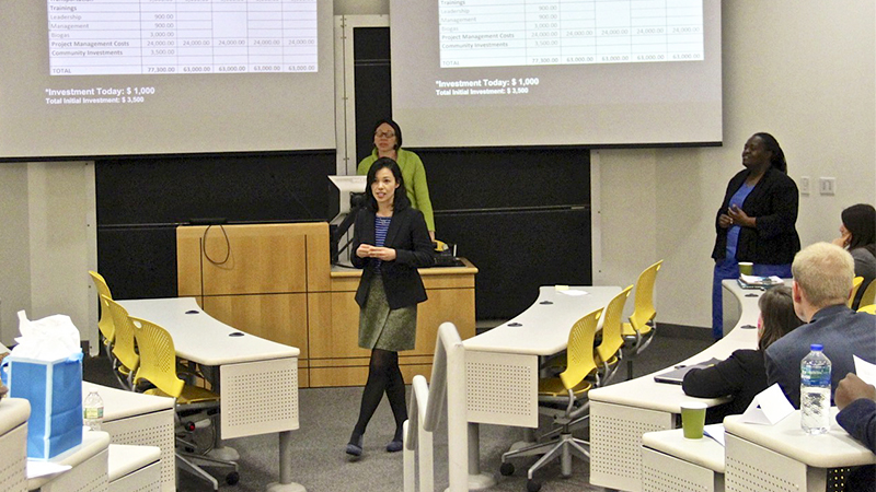 student presenting her startup pitch in front of classroom