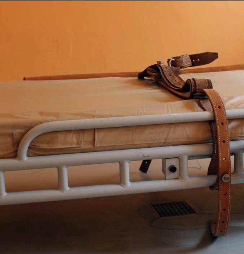 image of hospital bed with restraints