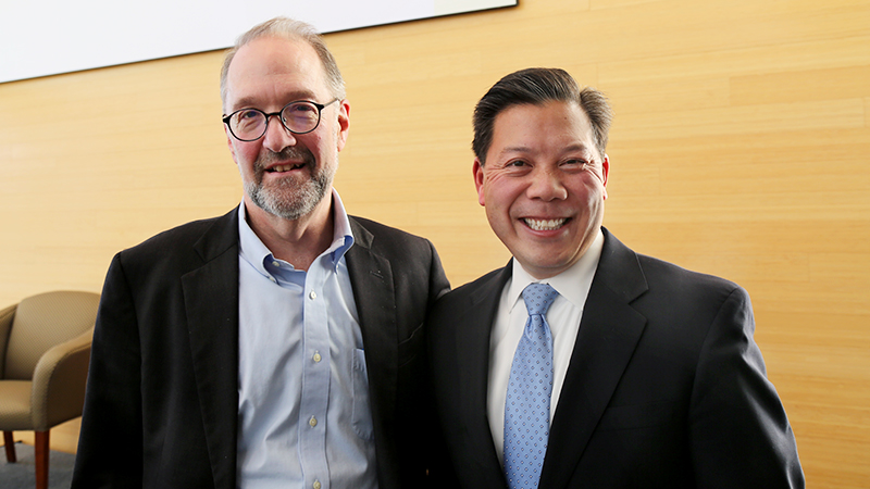 Chris Lu and Dean Weil standing together smiling