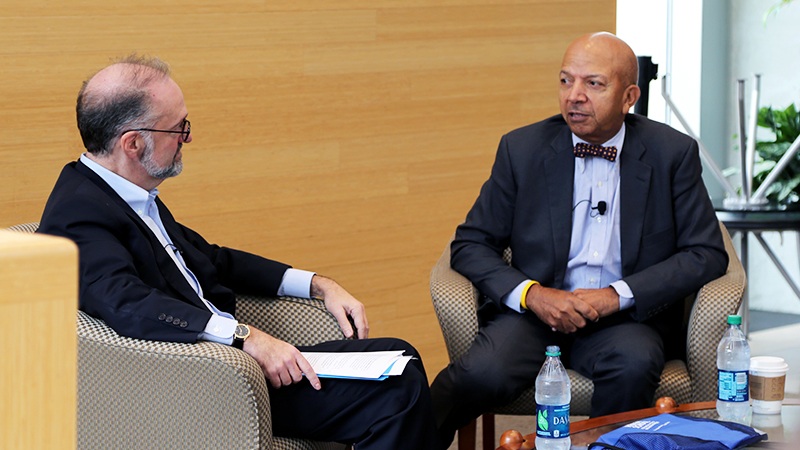 close-up of Dean Weil and Anthony Williams speaking to each other