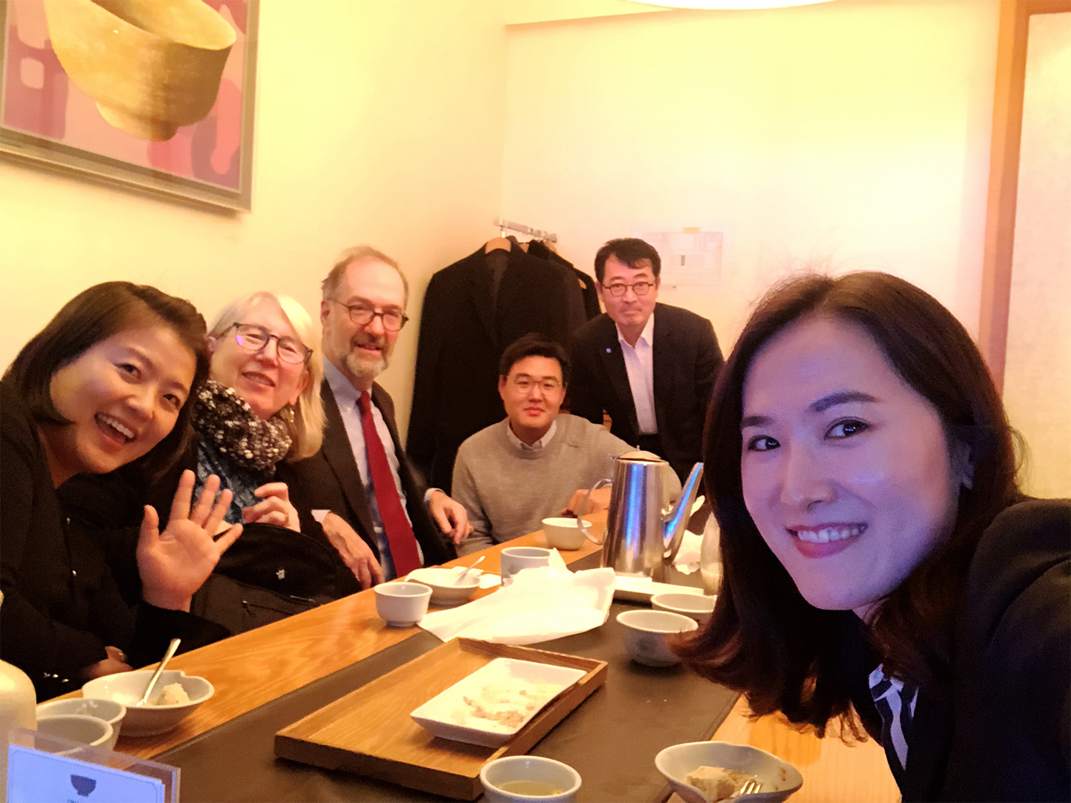Dean Weil and alumni in Seoul at a restaurant