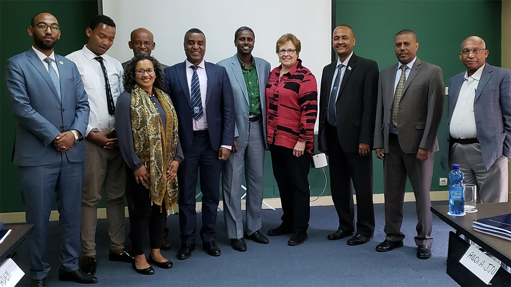 Tammy Tai and Della Hughes in Ethiopia with presidents of five universities and VP of Academic Affairs and representatives from Save the Children Ethiopia