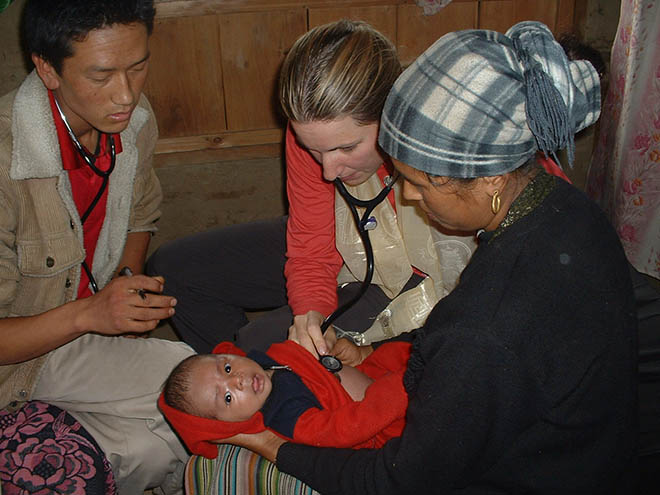 Health care workers with a baby in Nepal