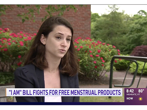 Charlotte Powley with words "I am" bill fights for free menstrual products
