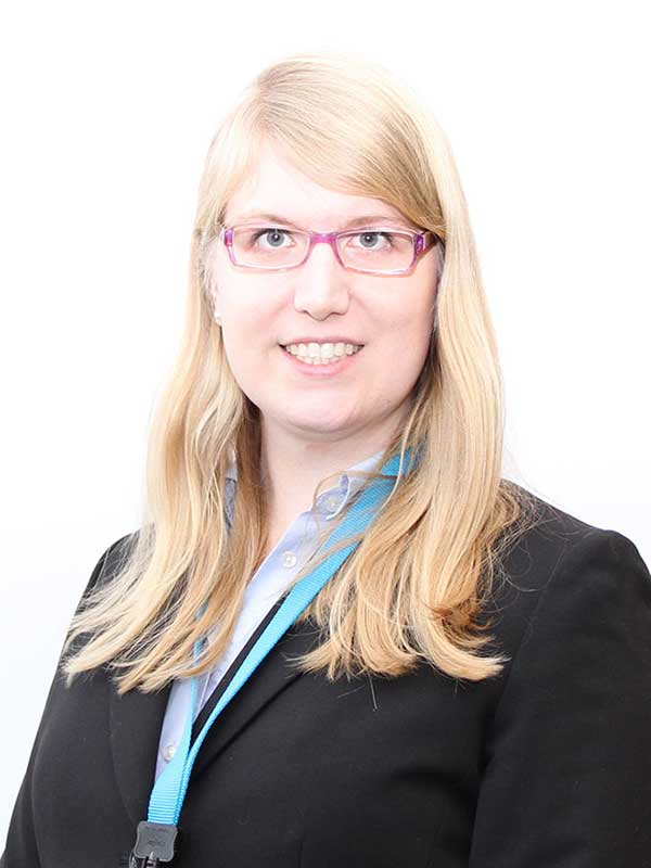 Emilia Dunham, MBA/MPP'15 in a black suit