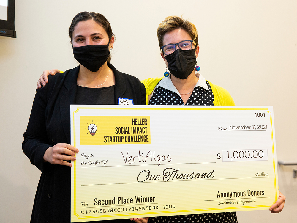 Two students pose with a check for the VertiAlgas team