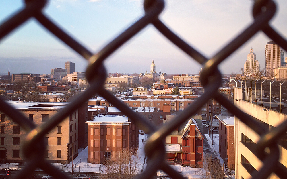 Hartford, Connecticut skyline through closeup of wire fence