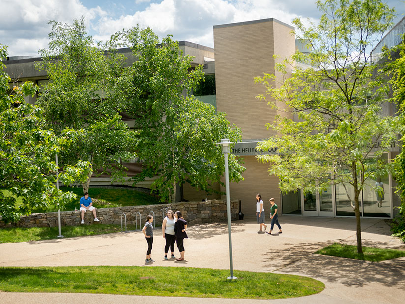 Students outside the Heller School building entrance