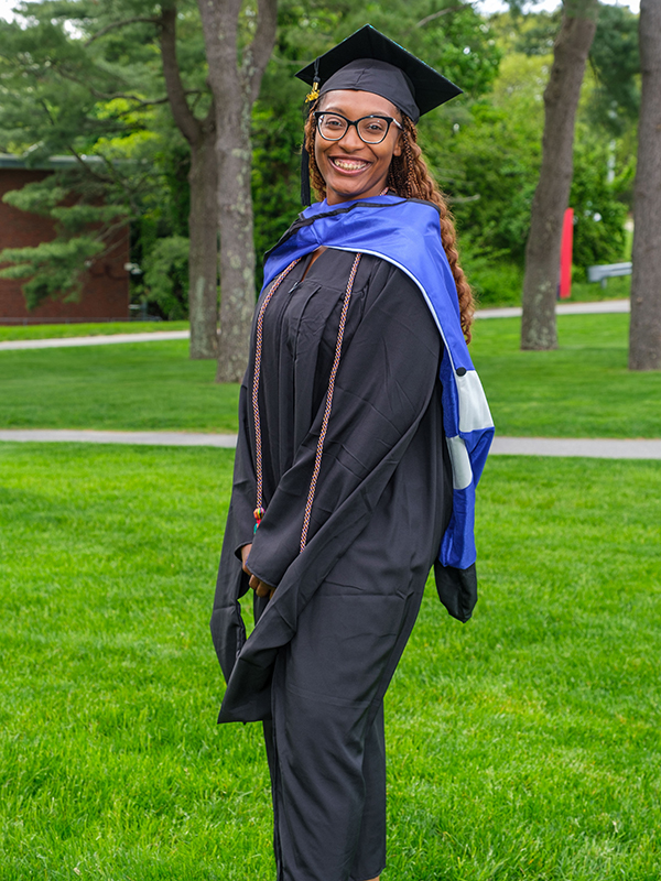 Ashley Robinson, MBA/MA SID'24, in graduation cap and gown