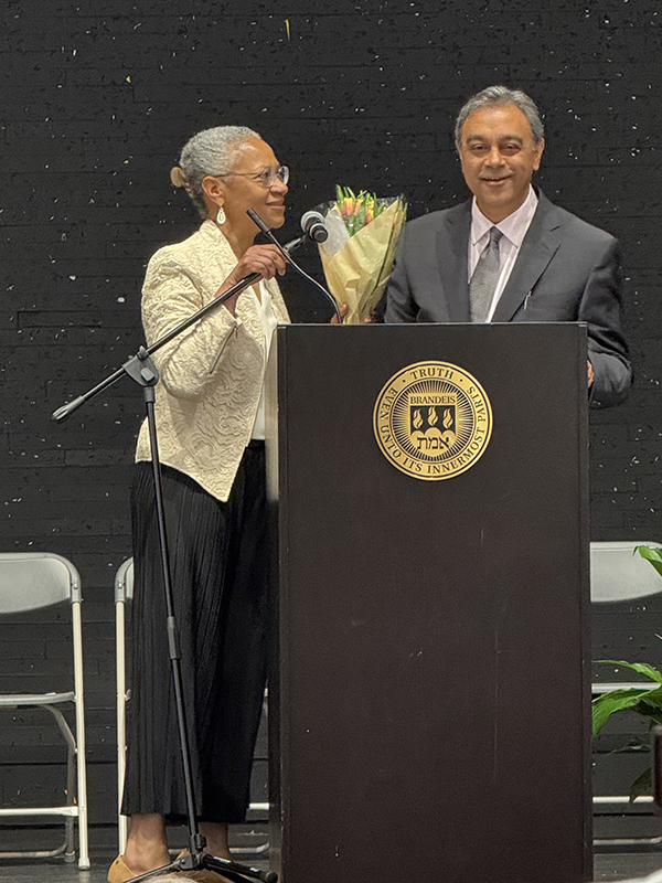 Associate Dean Ravi Lakshmikanthan, MA SID'99, introduces Interim Dean Maria Madison at the Heller Graduates Reception