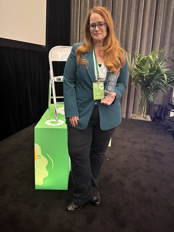 Sandra Jones poses with her We Rise Together Social Justice award at Duolingo's awards ceremony in Pittsburgh, PA.