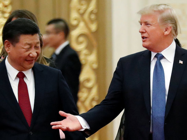 Xi Jinping walking next to Donald Trump