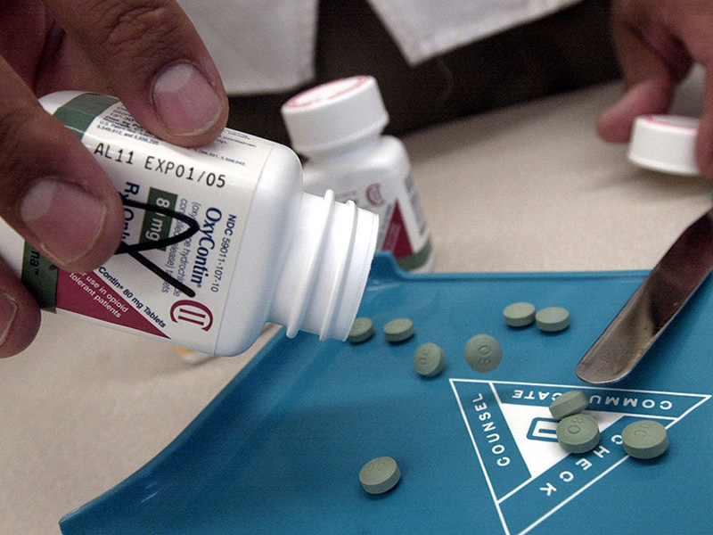 A bottle of OxyContin with pills