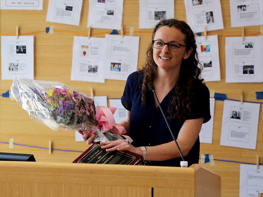 Liz Keeffe, MBA/MA SID'18, receiving flowers