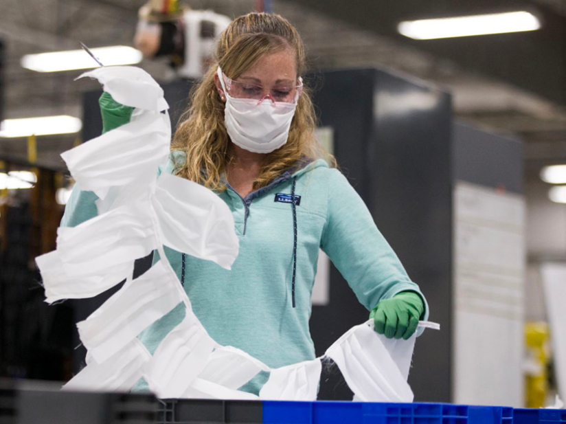 worker in a mask at ll bean factory