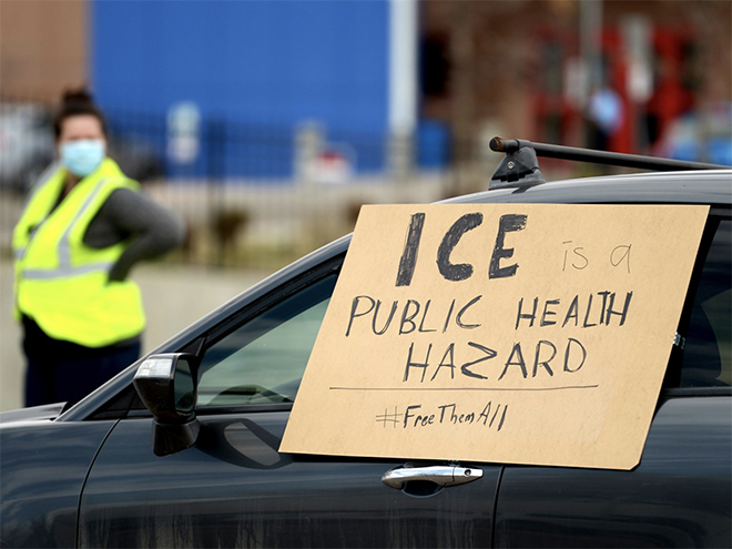 A sign that says ICE is a public health hazard #freethemall