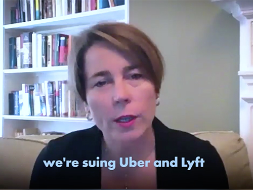 Attorney General Maura Healey on screen with subtitle reading "we're suing Uber and Lyft"