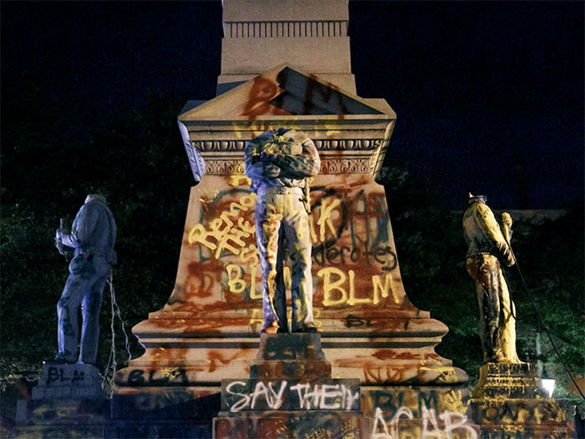 Headless statues spray painted with BLM