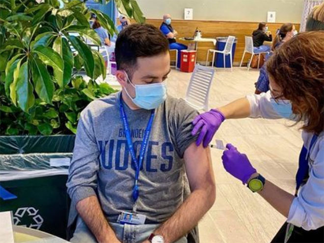 Lewis Novack, MS'18, getting the COVID-19 vaccine