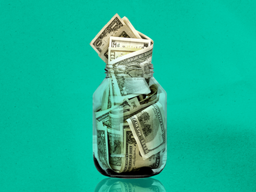 Photo illustration of money in a jar