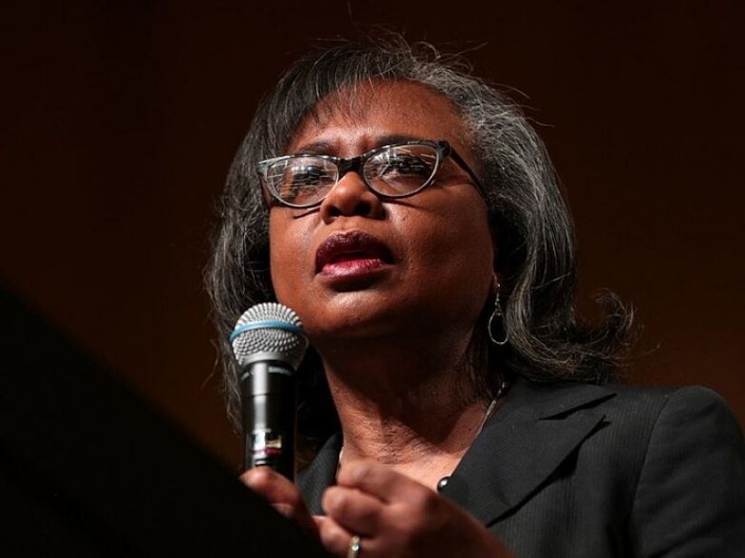 Anita Hill with a microphone