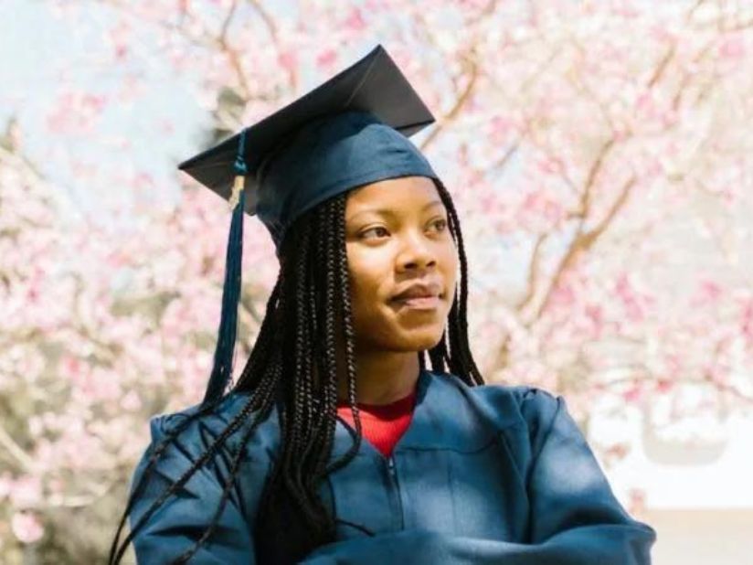A black student with a graduation gown