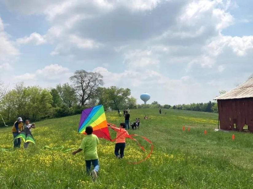 Children running kites