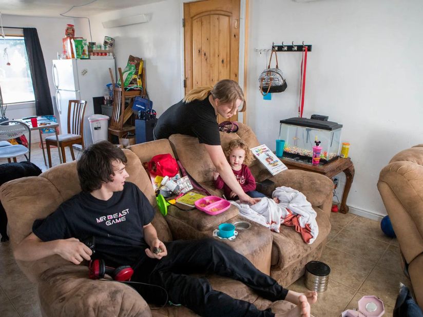Jesus Montiel, Krista Mason and their daughter, Diana, 2, spend time together at their home in Wyoming, where inflation has been hitting families hard