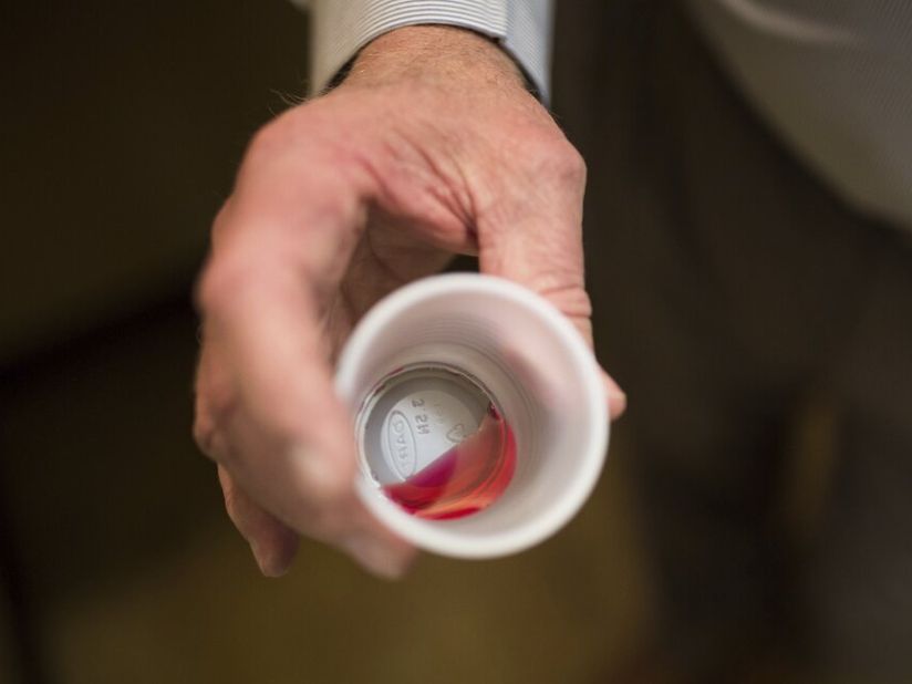 A liquid dose of methadone is seen in a plastic cup. Studies have found the use of medication combined with counseling is more effective in keeping patients with opioid use disorder in treatment