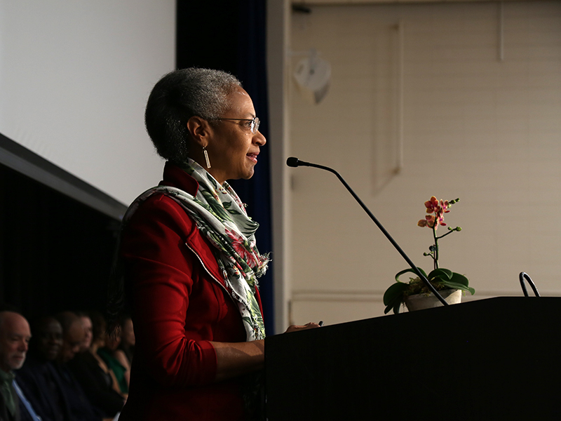 Maria Madison speaks at a podium at the Heller Reception