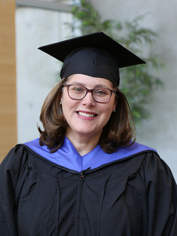 Laura Lee wearing a cap and gown