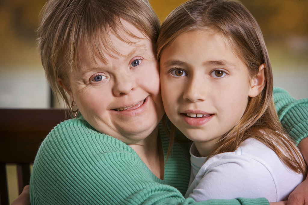 A woman with Down Syndrome and her daughter.